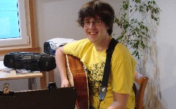 Anthony taking a guitar lesson