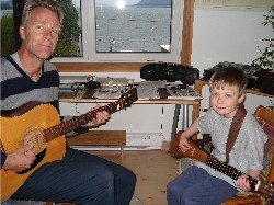 Eli taking a guitar lesson